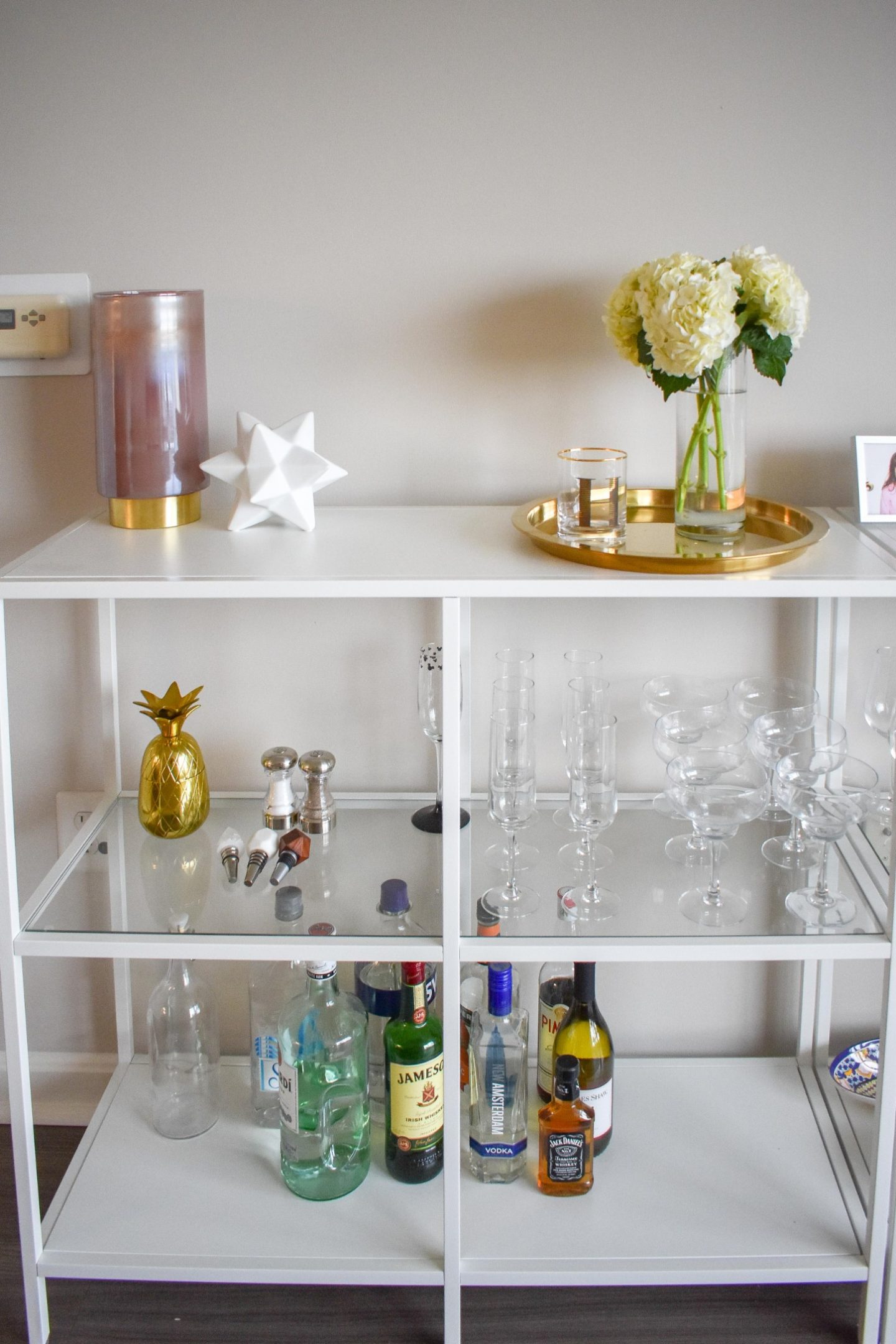 I'm showing off my IKEA bar cart (which are bar shelves, let's be honest) and how I decorated them with all the cute glassware and trinkets!